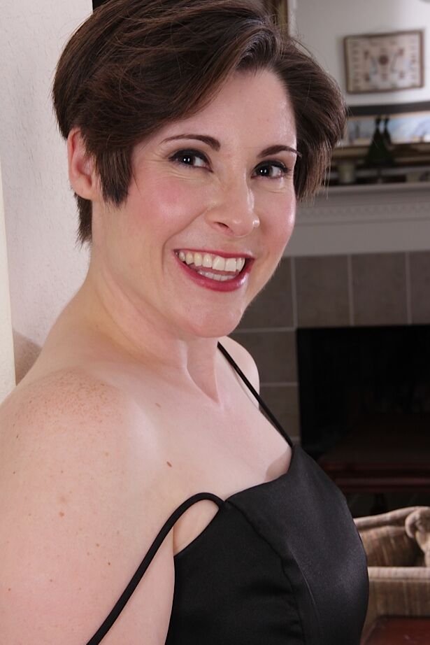 16P Short haired older lady Sadie Jones undressing for masturbation session