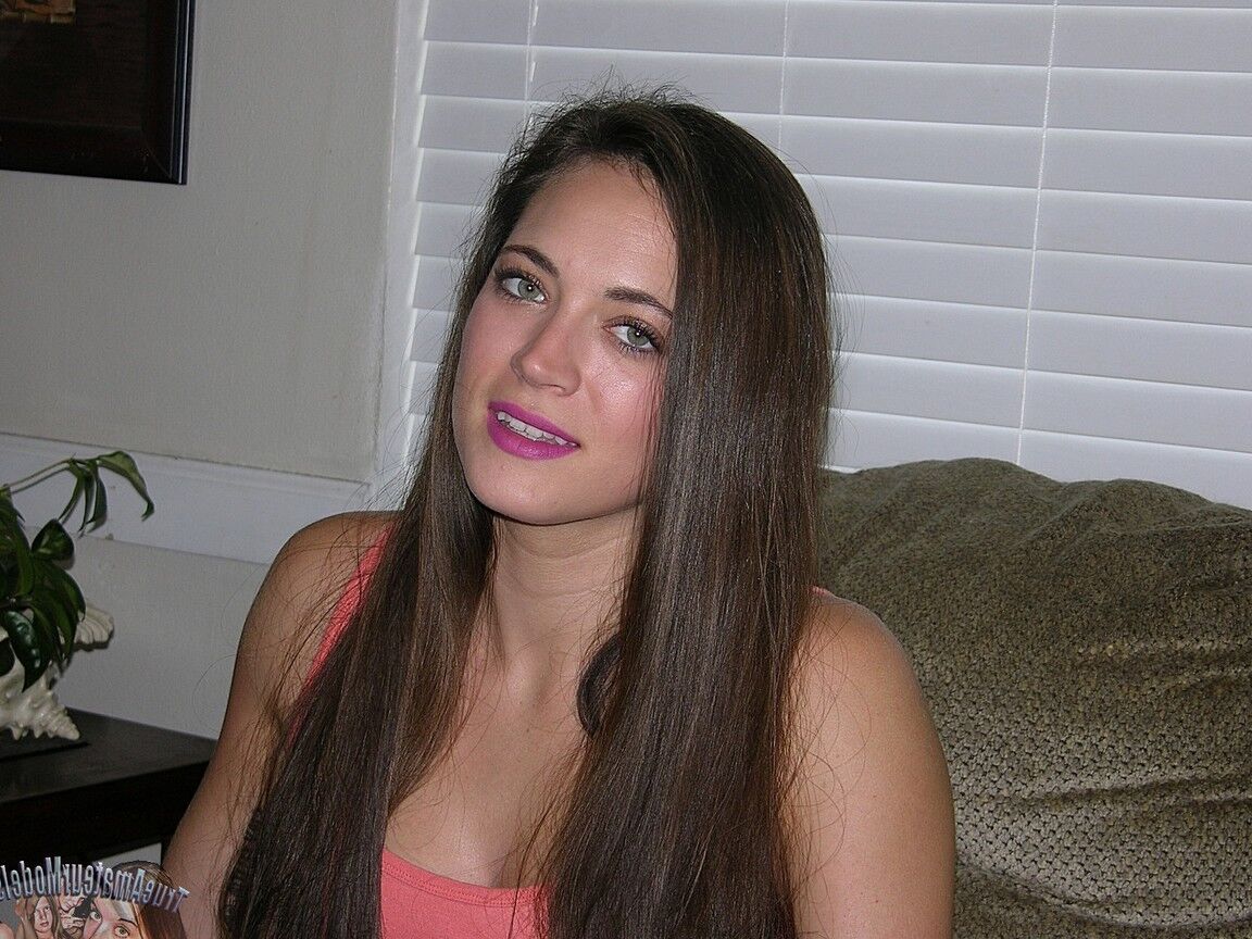 16P Long haired girl Dacey puts her trimmed muff on display for the first time