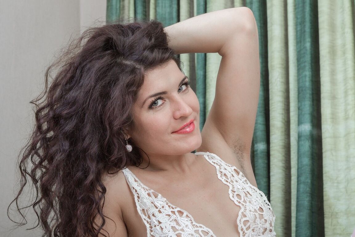 16P Solo model Rimma S removes sexy lingerie & nylons before playing with her bush