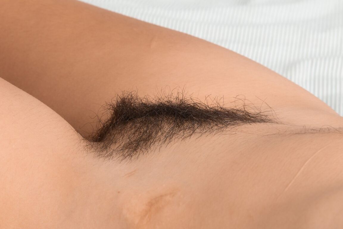21P Hairy Latina Andy Moon strips her bodysuit off and spreads her bushy beaver