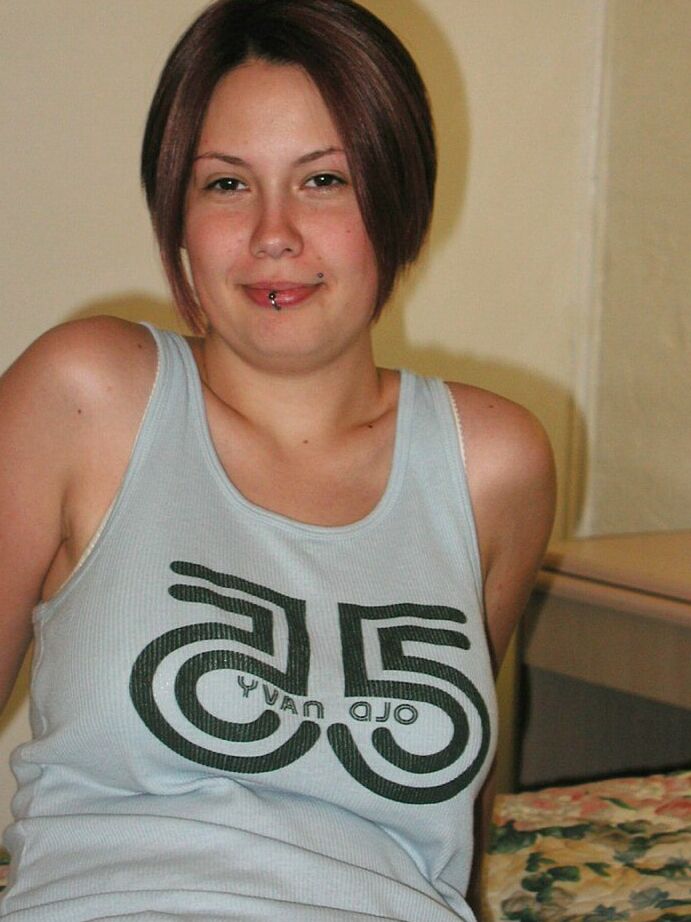 16P Amateur Latina Gwen displaying tattoos and big natural tits after undressing