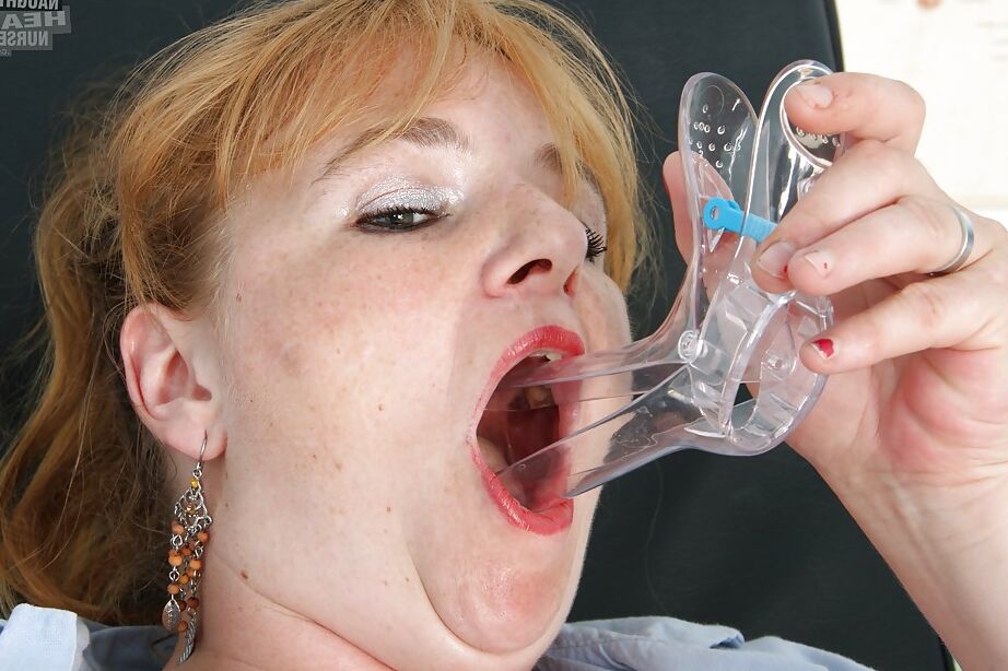 16P Chubby mature nurse playing with a black dildo and a speculim