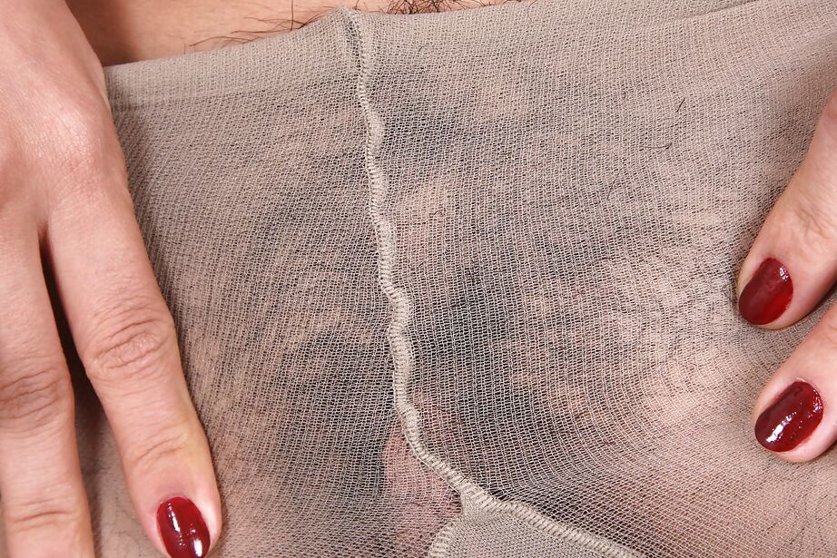16P Filthy babe with big tits taking off her pantyhose and teasing her bush