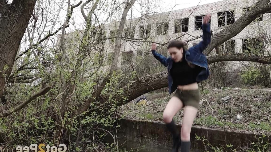 15P Distressed girl ventures out onto a tree branch for a badly needed pee