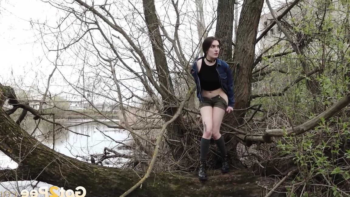 15P Distressed girl ventures out onto a tree branch for a badly needed pee