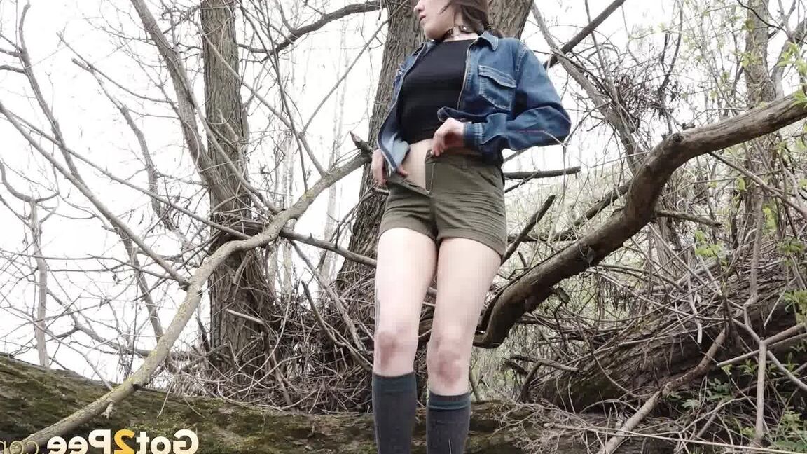 15P Distressed girl ventures out onto a tree branch for a badly needed pee
