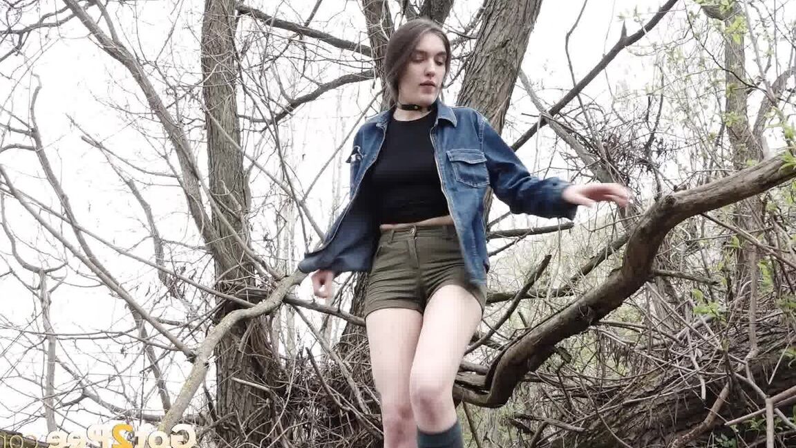 15P Distressed girl ventures out onto a tree branch for a badly needed pee