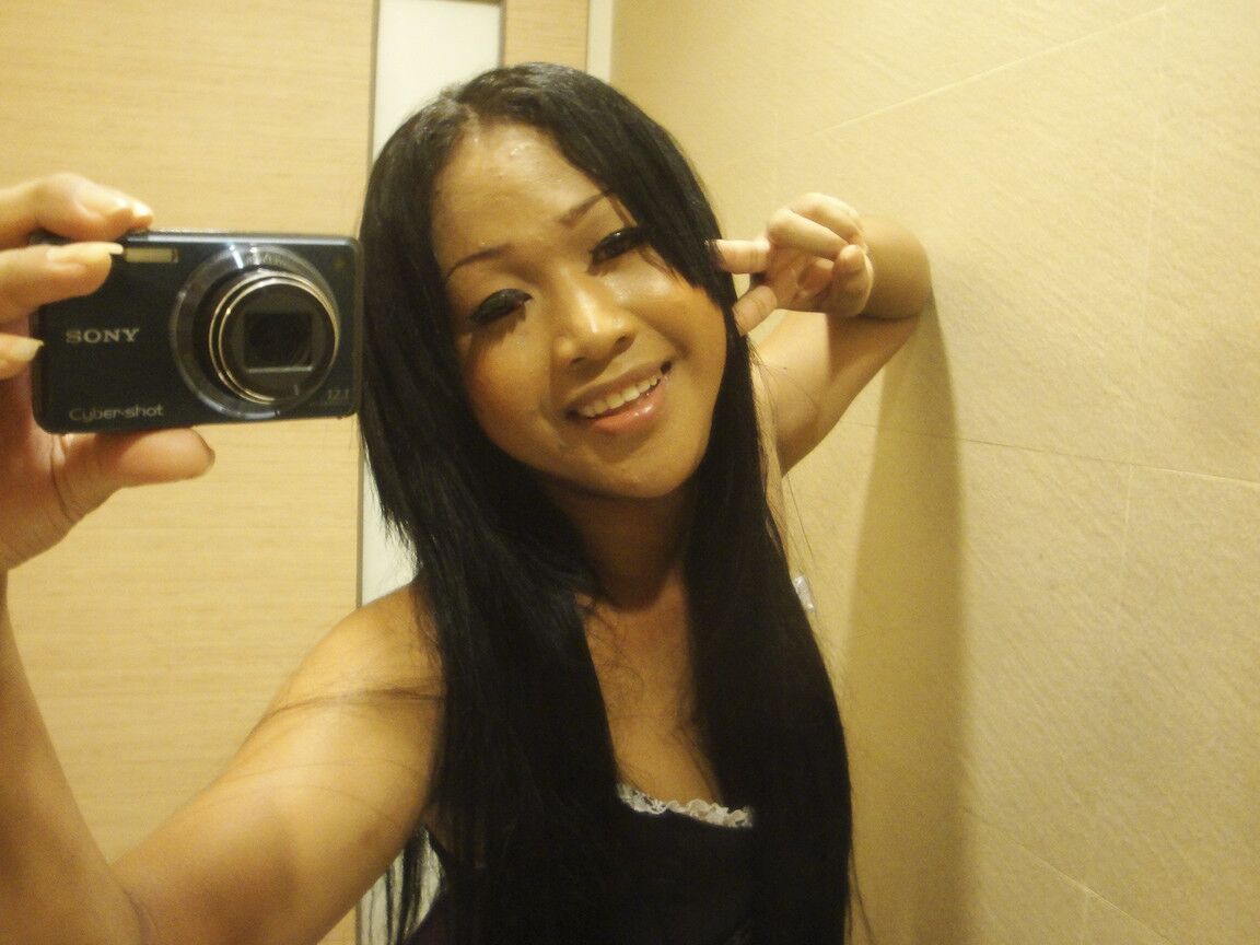 17P Bathroom flashing session featuring smiling Asian tranny with long hair