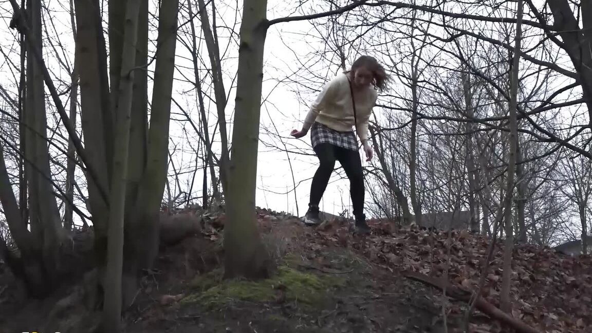 15P Caucasian girl takes a piss in an outhouse while in a forest
