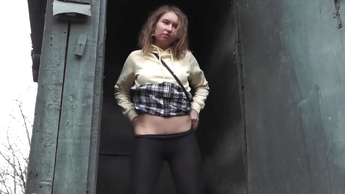15P Caucasian girl takes a piss in an outhouse while in a forest