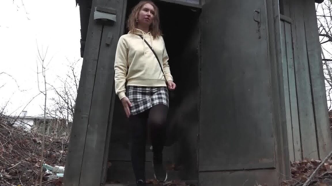 15P Caucasian girl takes a piss in an outhouse while in a forest