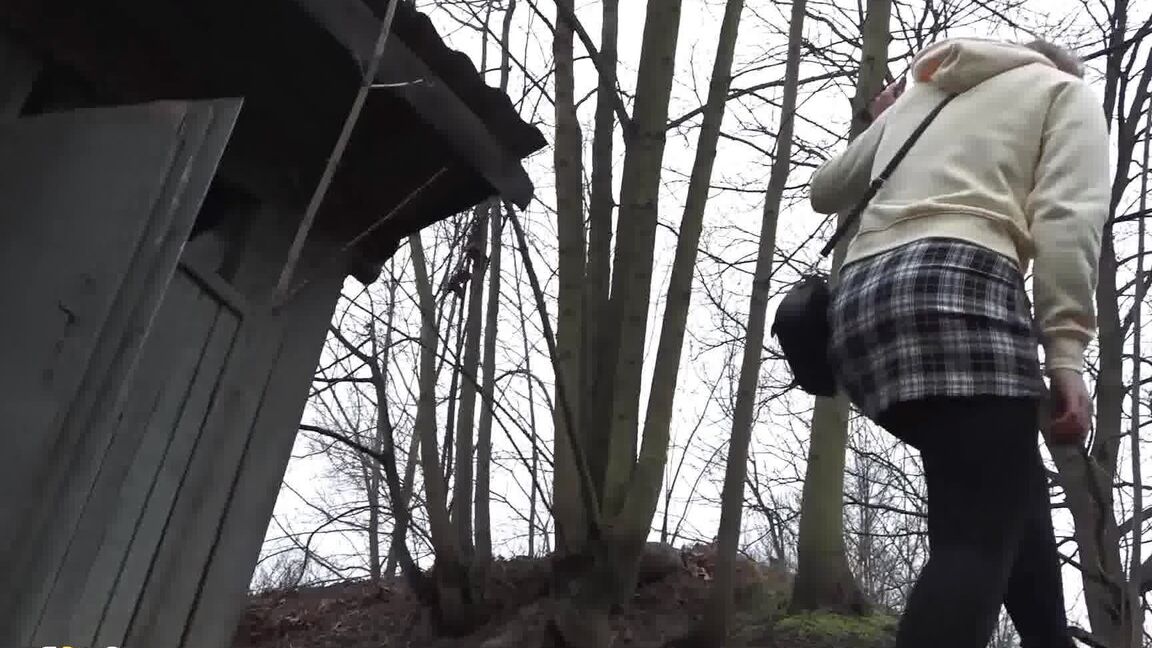 15P Caucasian girl takes a piss in an outhouse while in a forest