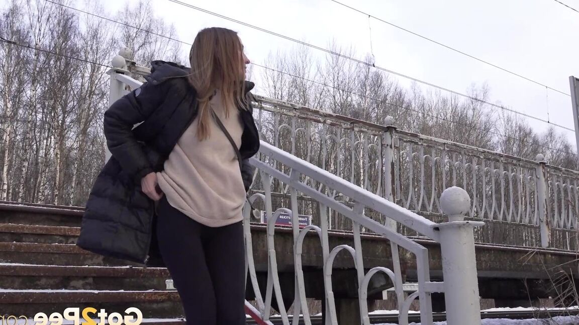 15P Caucasian female Valya takes a piss on snow-covered steps in public