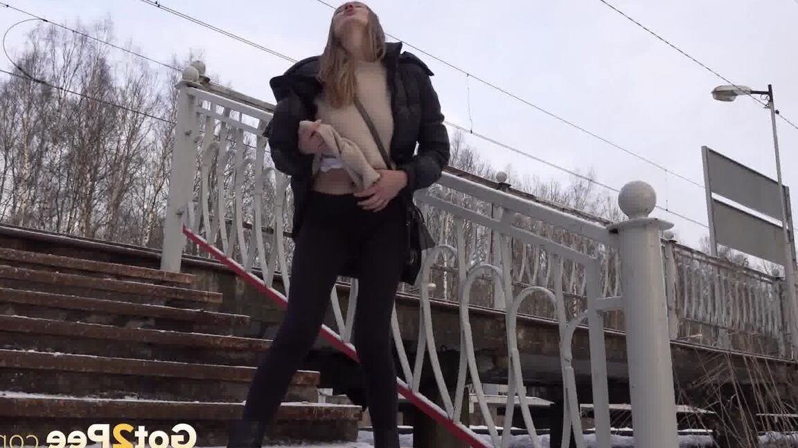 15P Caucasian female Valya takes a piss on snow-covered steps in public