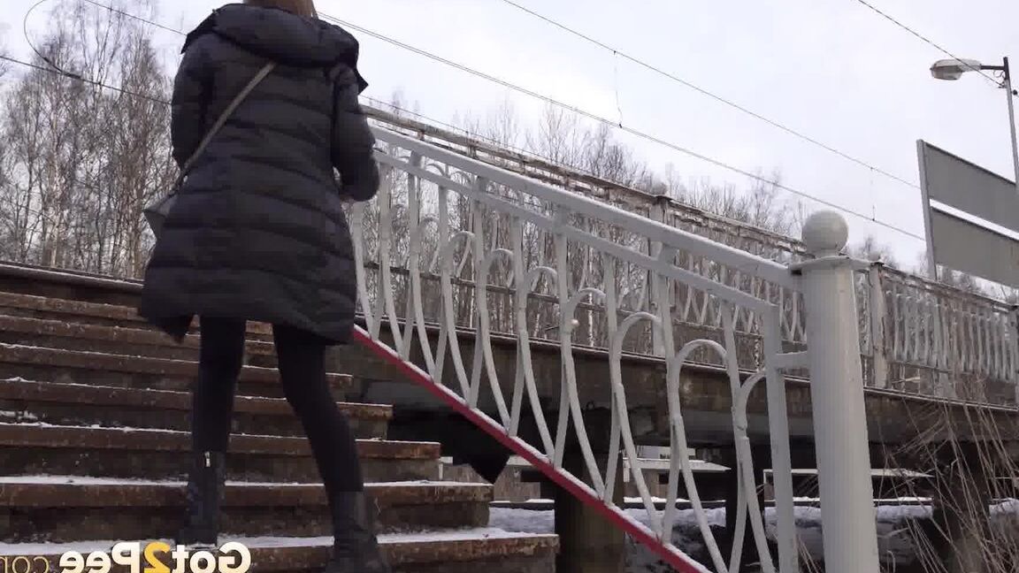 15P Caucasian female Valya takes a piss on snow-covered steps in public