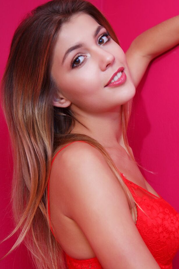 16P Gorgeous teen Monika Dee showcases her pussy in a red tutu and matching nylons