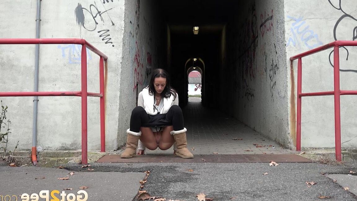 15P Eveline Neill pisses on the ground in the city