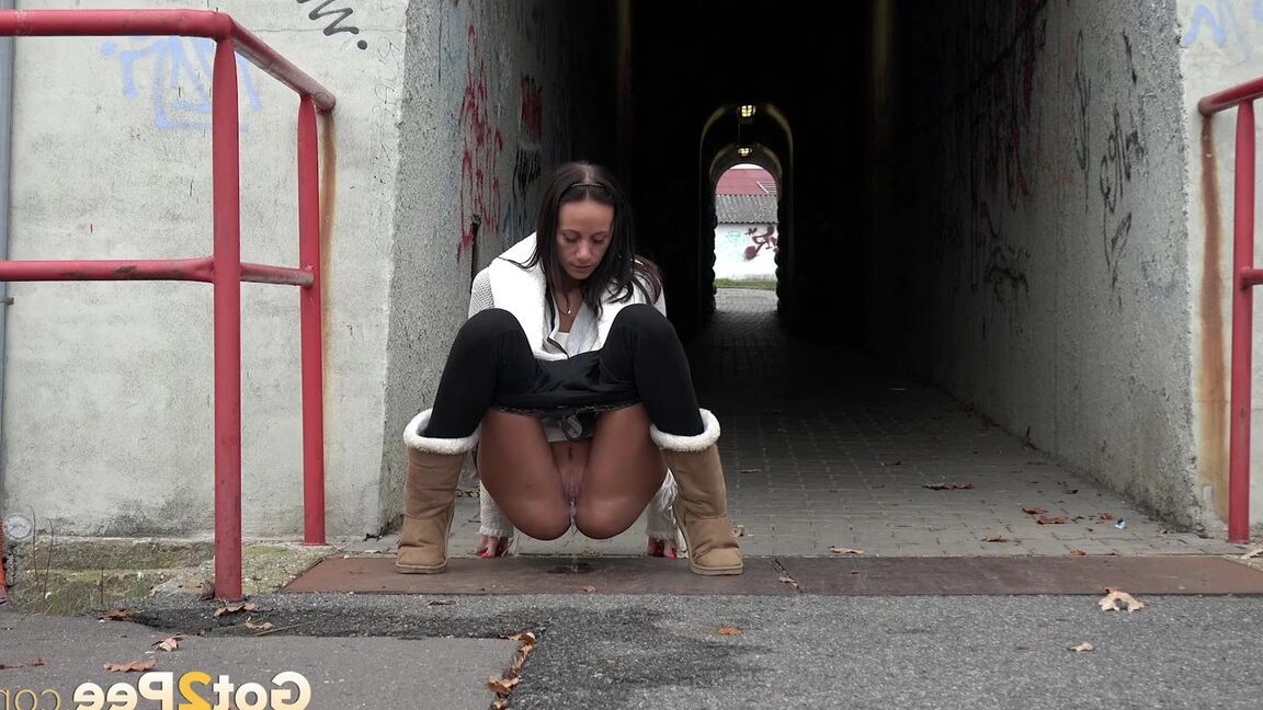 15P Eveline Neill pisses on the ground in the city