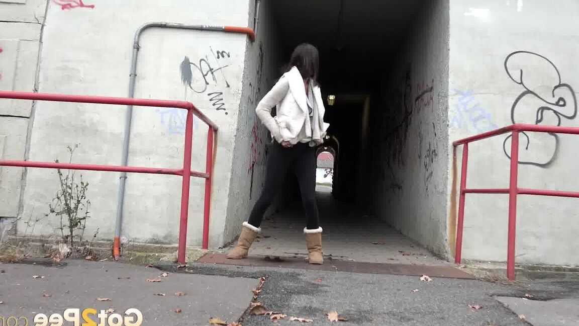 15P Eveline Neill pisses on the ground in the city