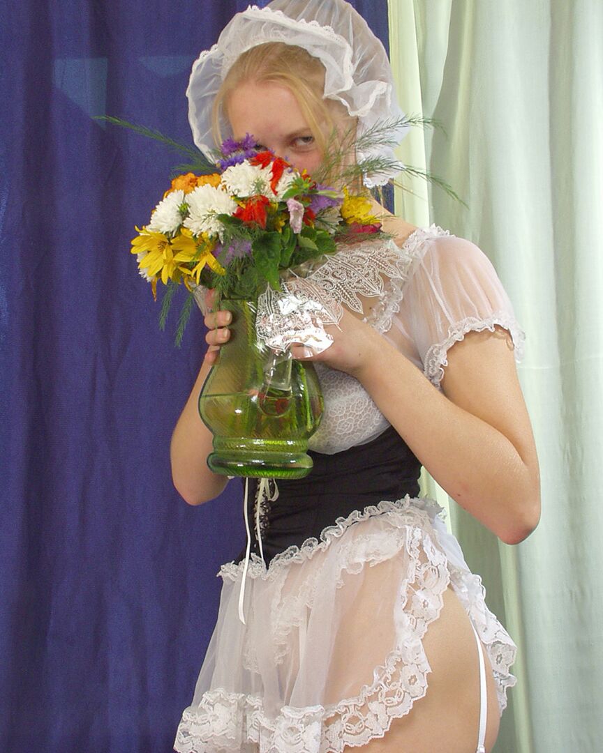 20P White girl removes maid attire before peeing on a bunch of flowers