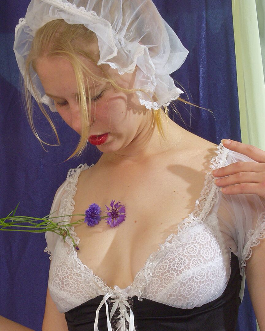 20P White girl removes maid attire before peeing on a bunch of flowers