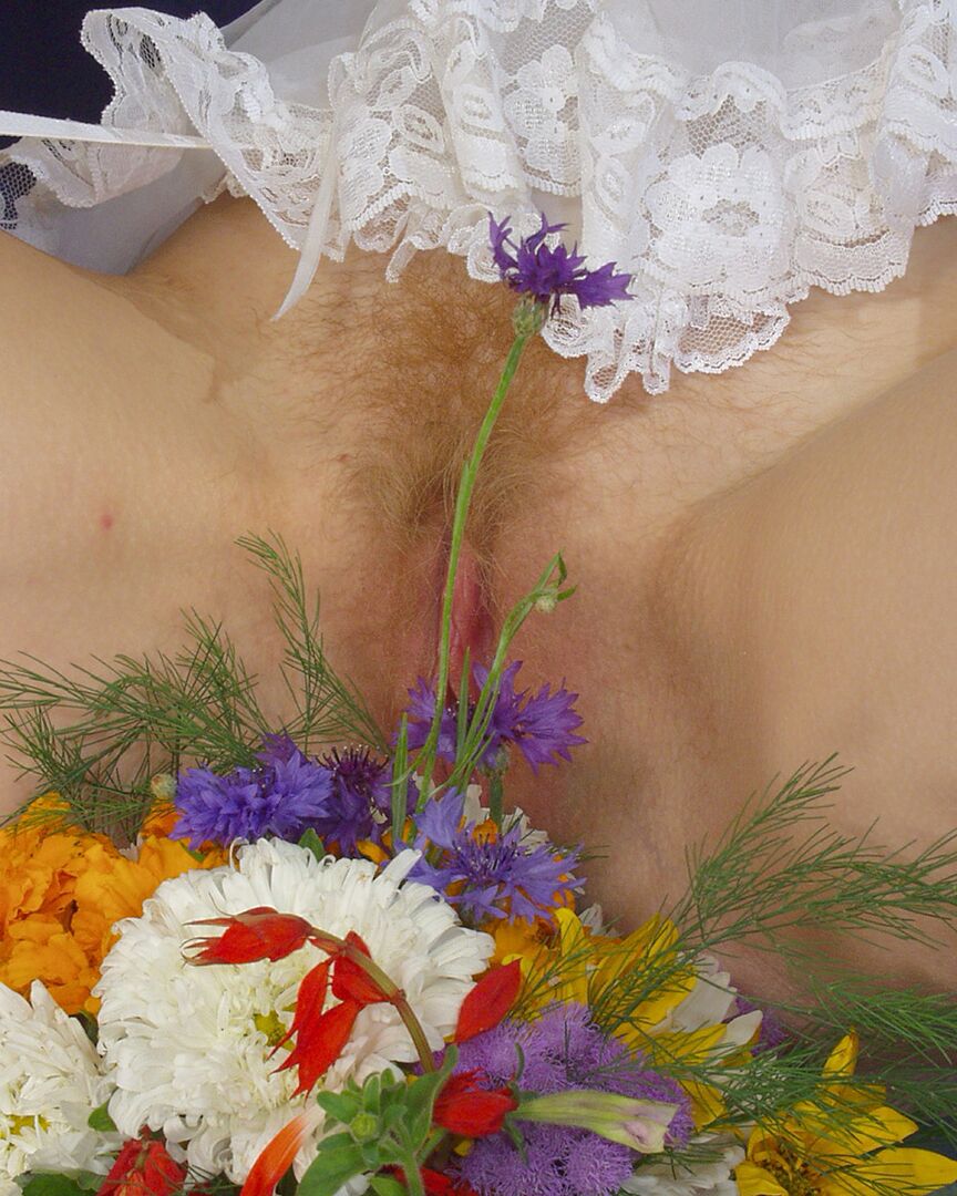 20P White girl removes maid attire before peeing on a bunch of flowers