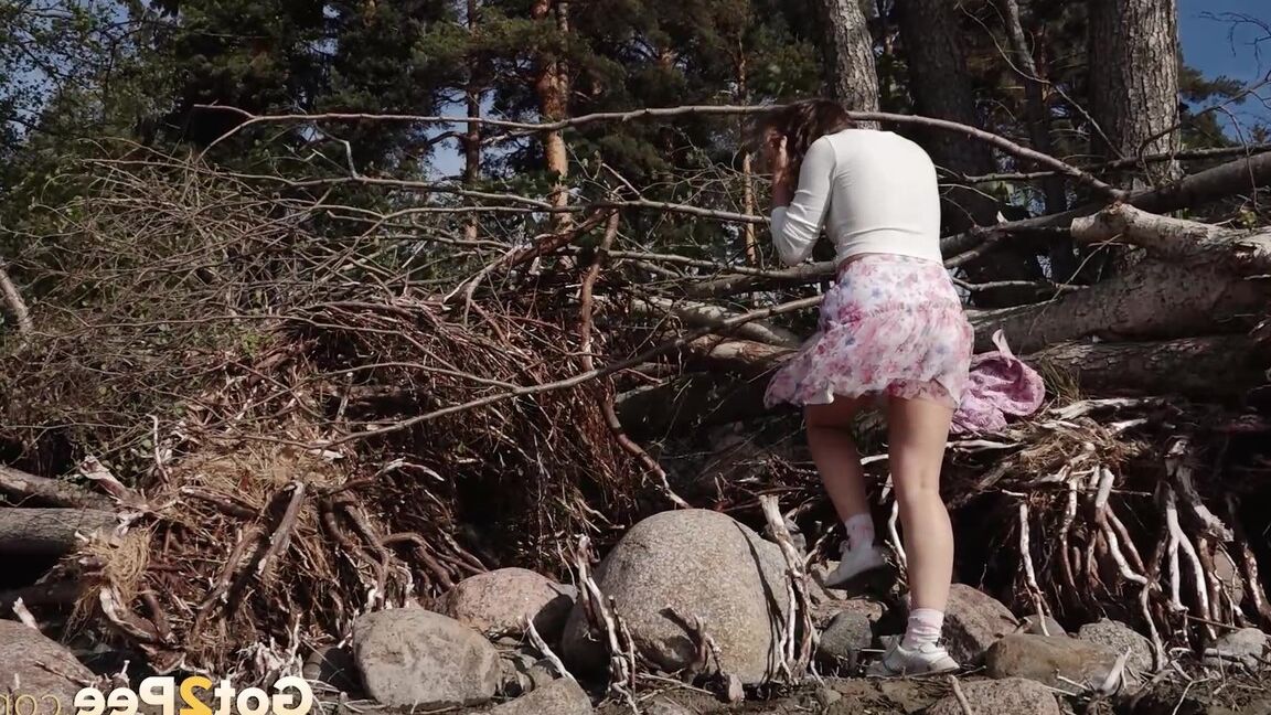 15P European babe squats over rocks to piss outside