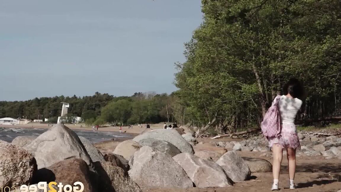 15P European babe squats over rocks to piss outside