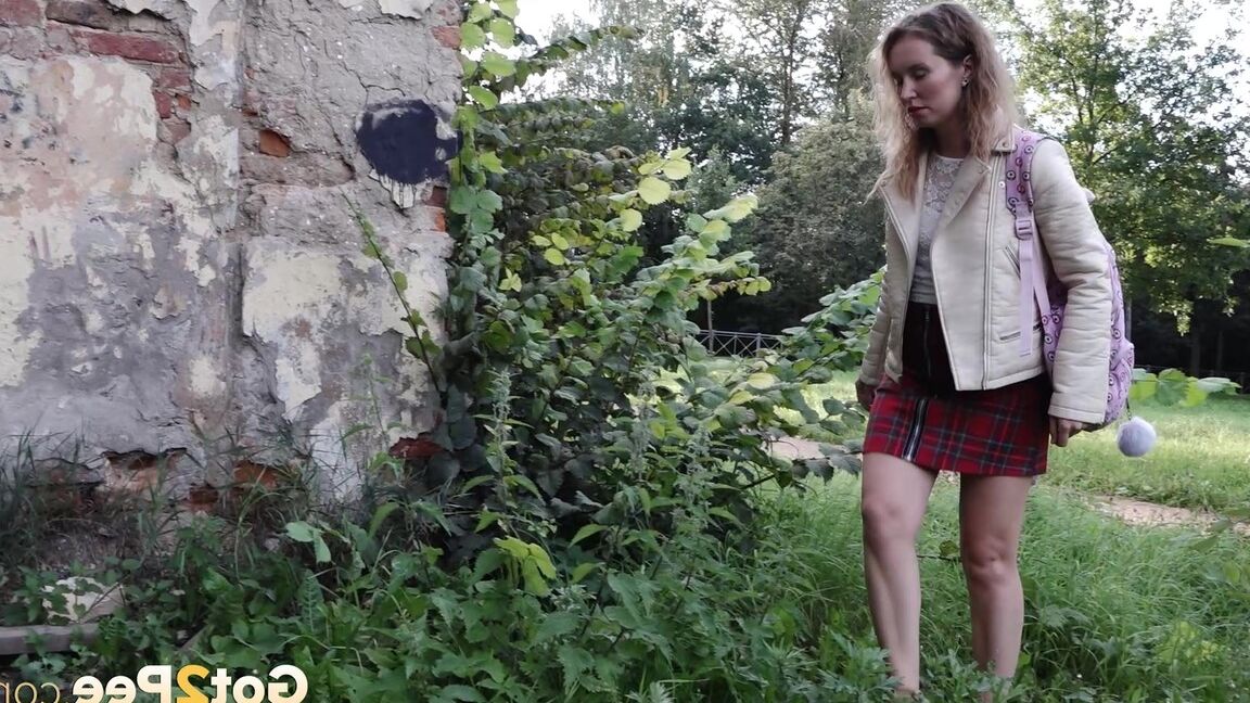 15P Short taken girl Rita ducks behind a building for a badly needed piss