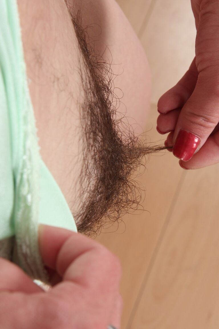 21P Black haired mature Rosetta exposes her hairy armpits and bushy twat