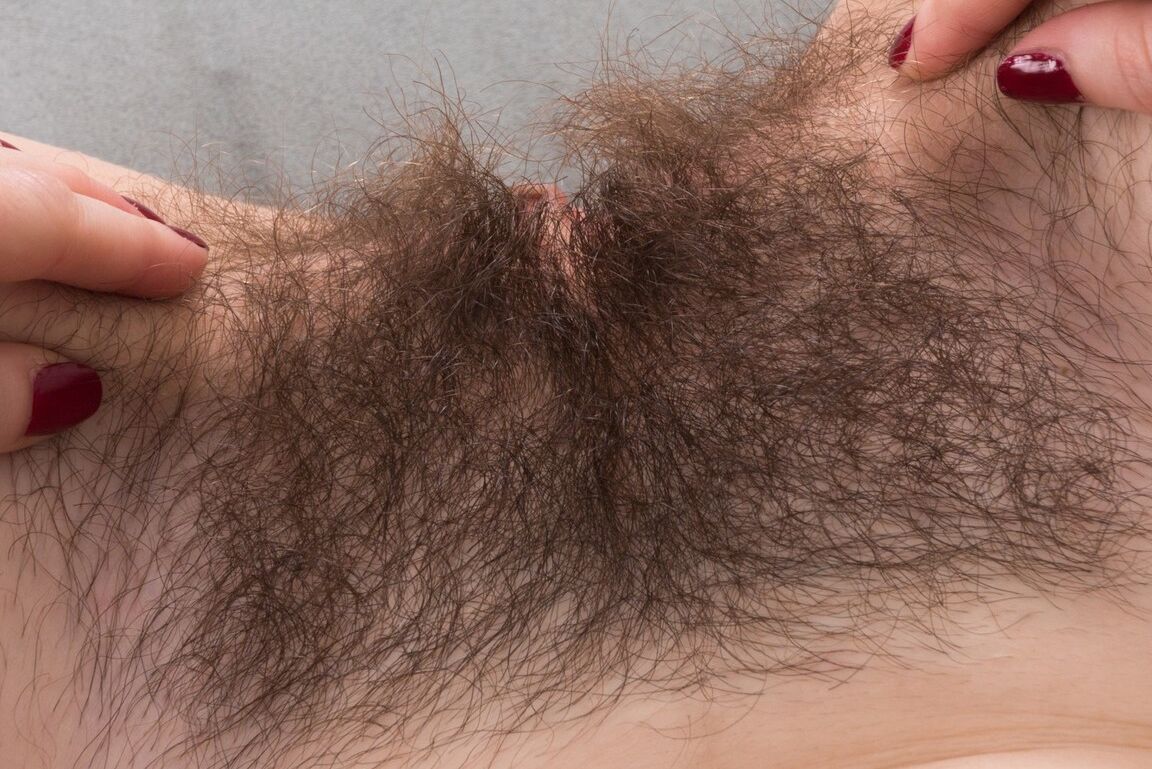 16P Sexy Kelly Morgan sheds her satin lingerie to spread hairy pussy lips close up