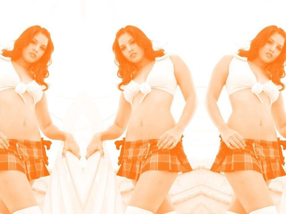 13P Hot brunette Sunny Leone models by herself during non-nude action