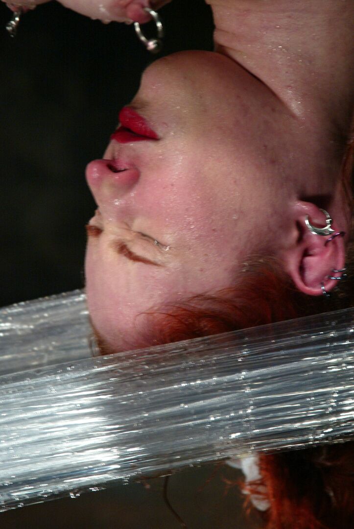 21P Redheaded American Calico gets tortured in brutal water bondage action