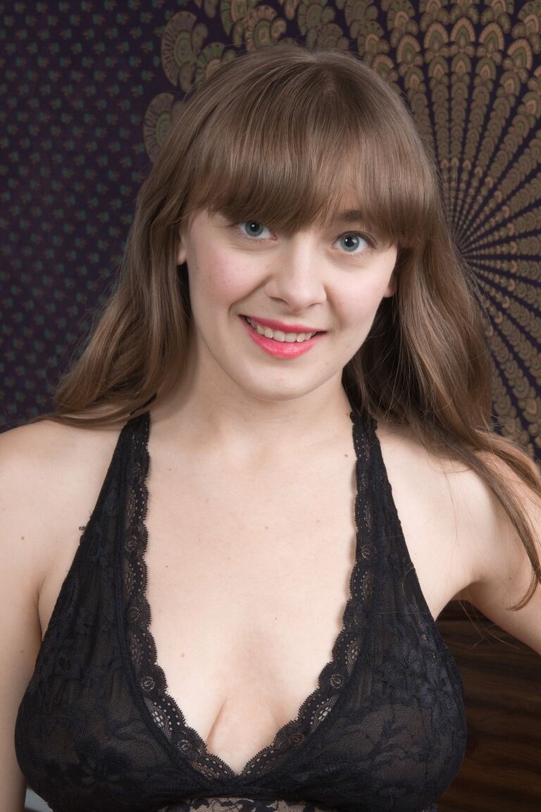 18P Charming Dani frees large breasts & spreads to toy her hairy muff on the bed