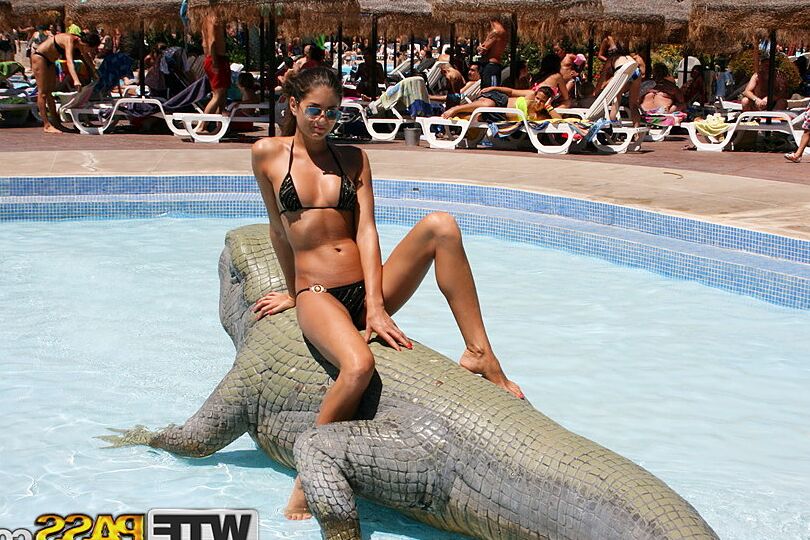16P Amateur chick Nessa models a bikini in a pool before going naked on a balcony