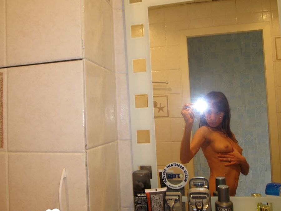 16P Beautiful brunette takes selfies while posing naked in the bathroom