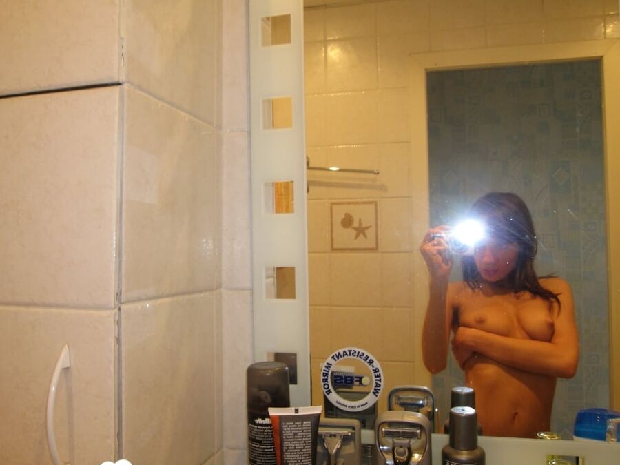 16P Beautiful brunette takes selfies while posing naked in the bathroom