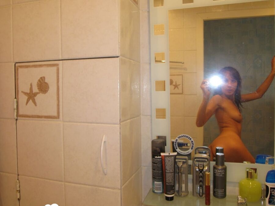 16P Beautiful brunette takes selfies while posing naked in the bathroom
