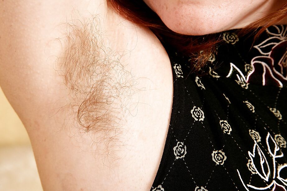 16P Lusty redhead MILF undressing and exposing her shaggy cooter in close up