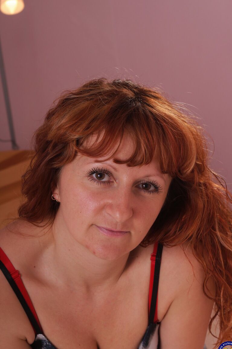 21P Mature nympho Olivia K penetrates her beaver with a huge black toy