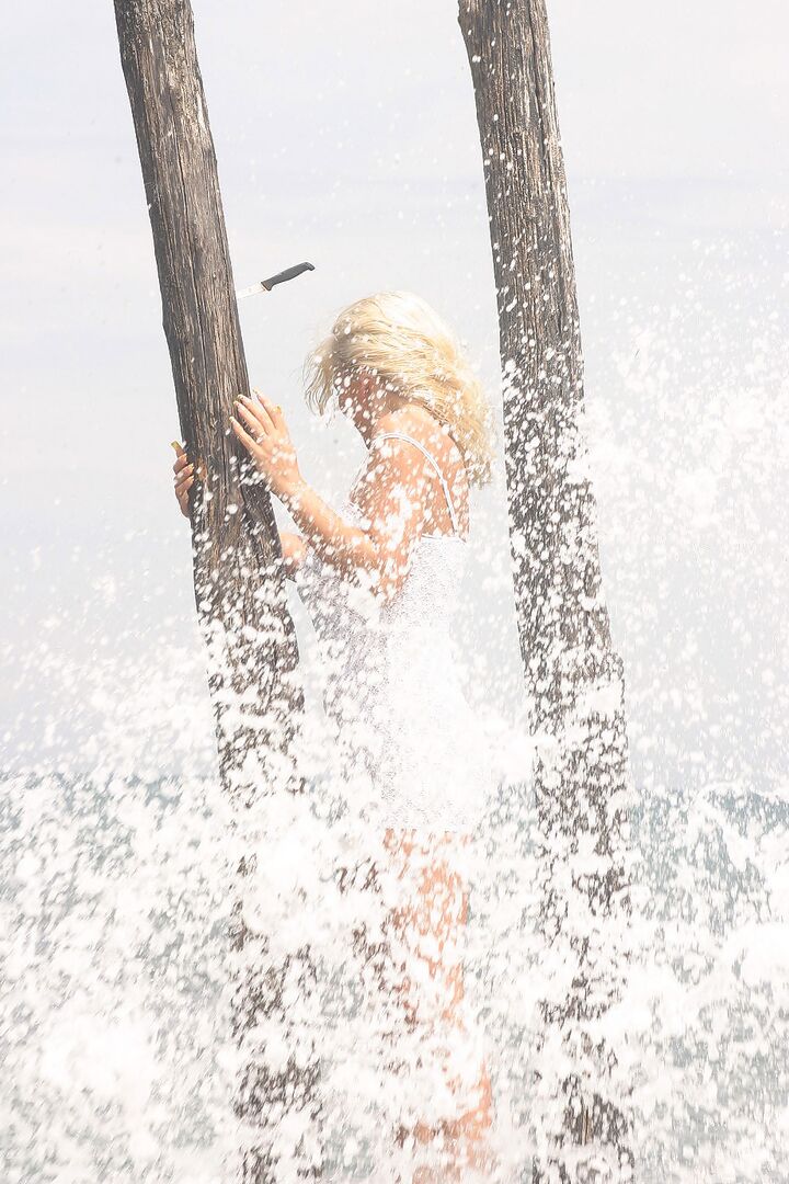16P Big titted blonde Ines Cudna gets soaked as a wave breaks over her by the sea