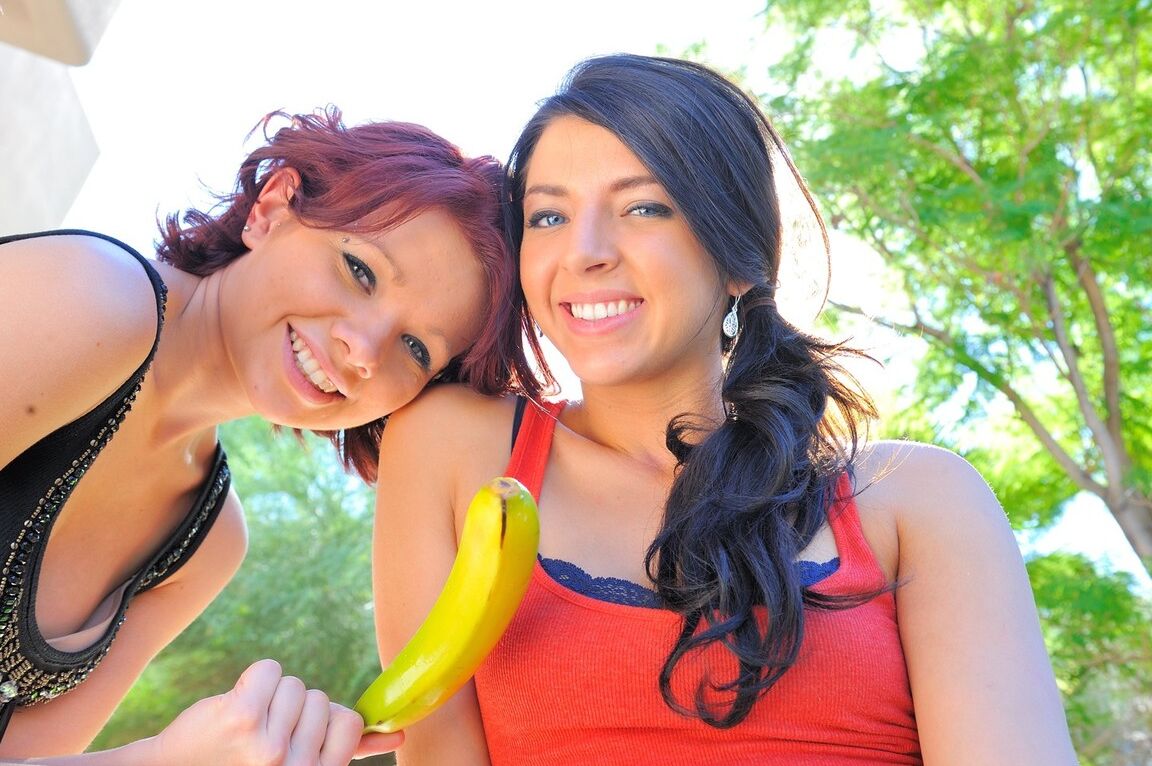 21P Young friends Madeline and Rita strip and stick a banana in their holes
