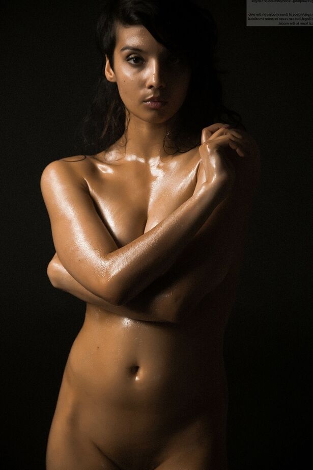 16P Naked Indian female exposes a single breast while modeling in the dark
