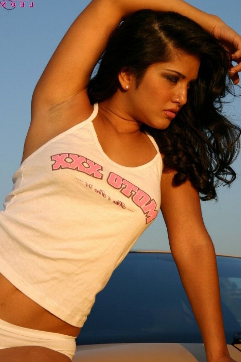 16P Indian model Sunny Leone in an outdoor photo shoot by a Lamborghini