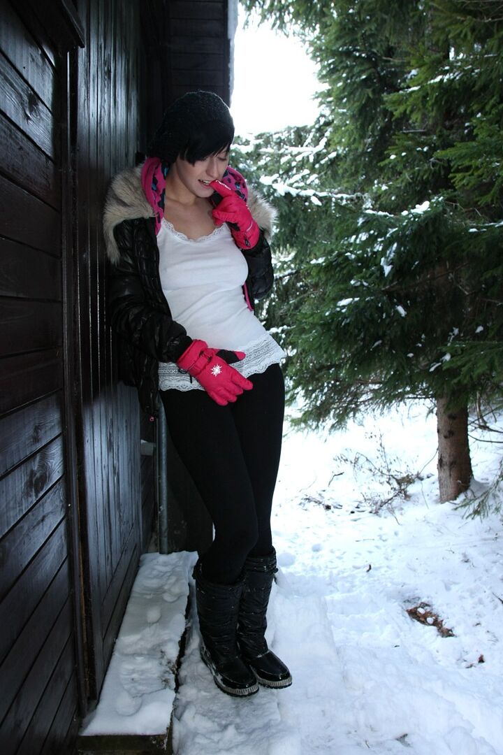 15P Barely legal brunette rubs her pussy on a snowy day behind a cabin in woods