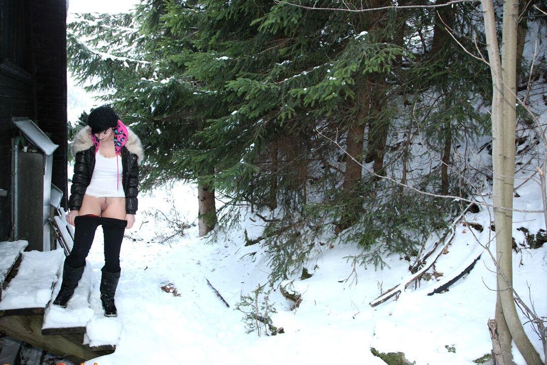 15P Barely legal brunette rubs her pussy on a snowy day behind a cabin in woods