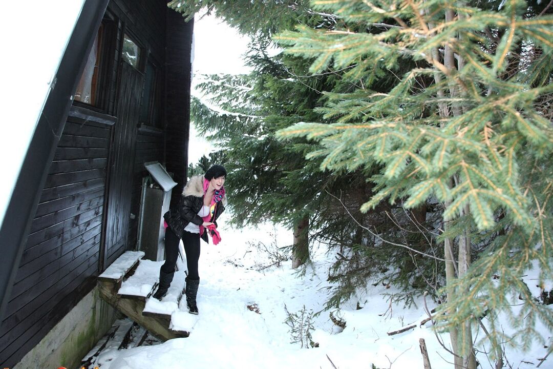 15P Barely legal brunette rubs her pussy on a snowy day behind a cabin in woods