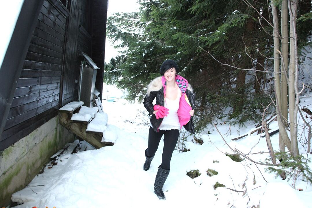 15P Barely legal brunette rubs her pussy on a snowy day behind a cabin in woods