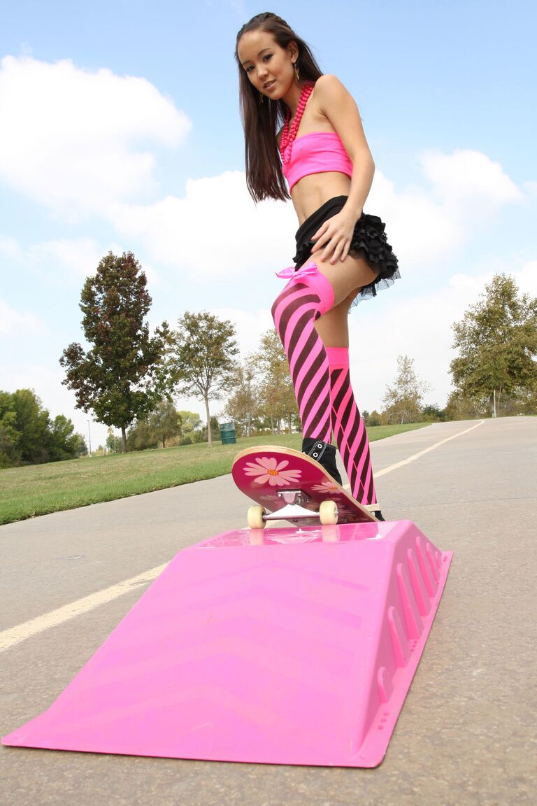 18P Tiny Asian teen Amai Liu posing in short skirt on the skateboard