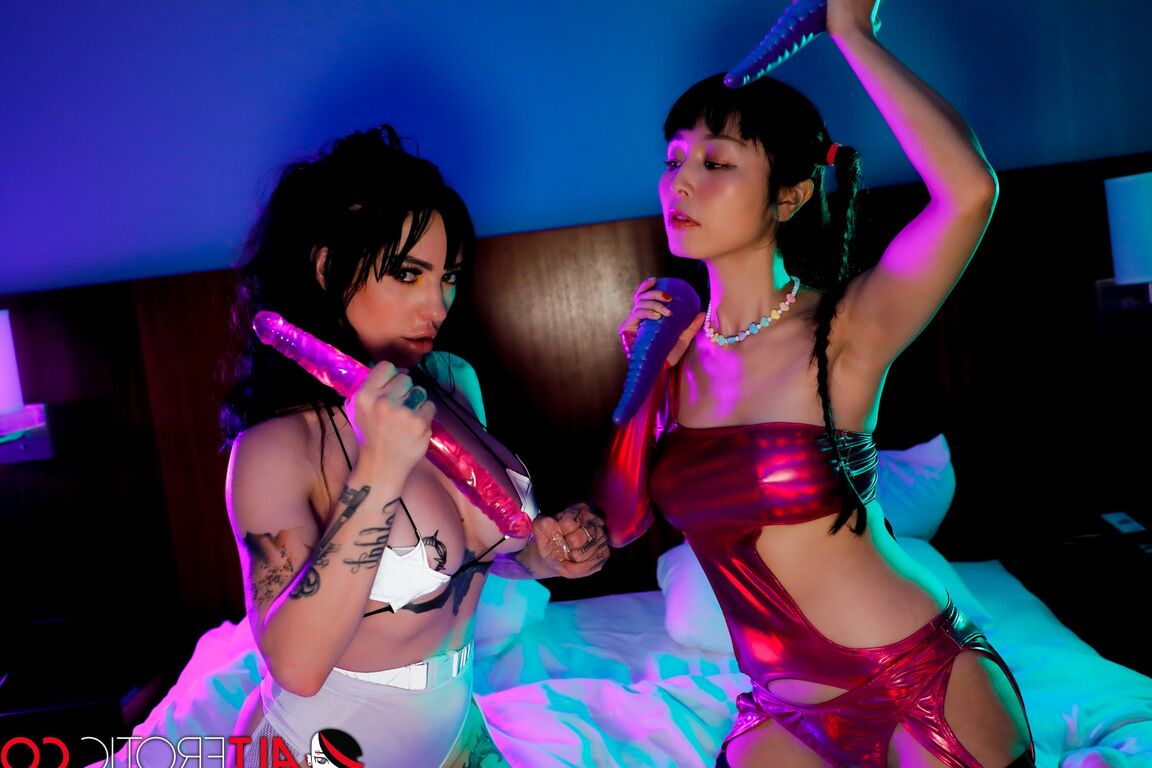16P Marica Hase & Misha Montana partake in a dildo fight on top of a bed